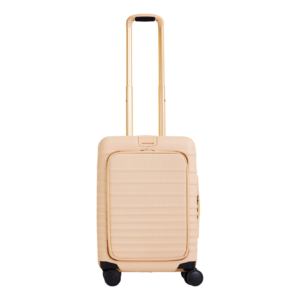 A chic, lightweight carry-on suitcase from a gift guide showcasing luxury travel accessories and gifts for women who travel.