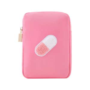 A trendy, compact pink travel-sized pill case with multiple compartments, designed for women who need to stay organized and stylish while traveling.