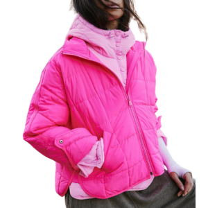 A vibrant bright pink packable jacket featured in a gift guide for women that travel as a lightweight, versatile gift for women who travel, perfect for layering and easy packing.